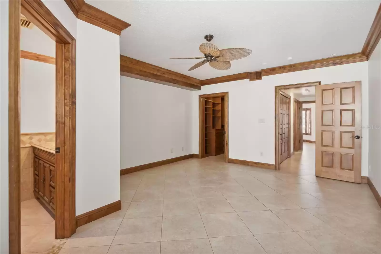 Primary bedroom with en suite bathroom and walk in closet