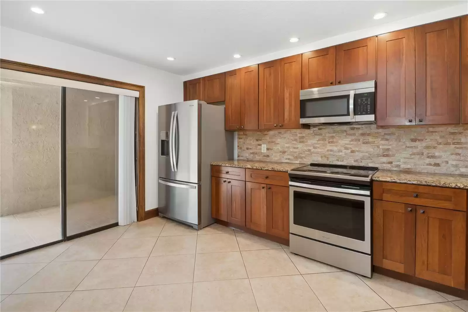 Kitchen with sliders to front patio