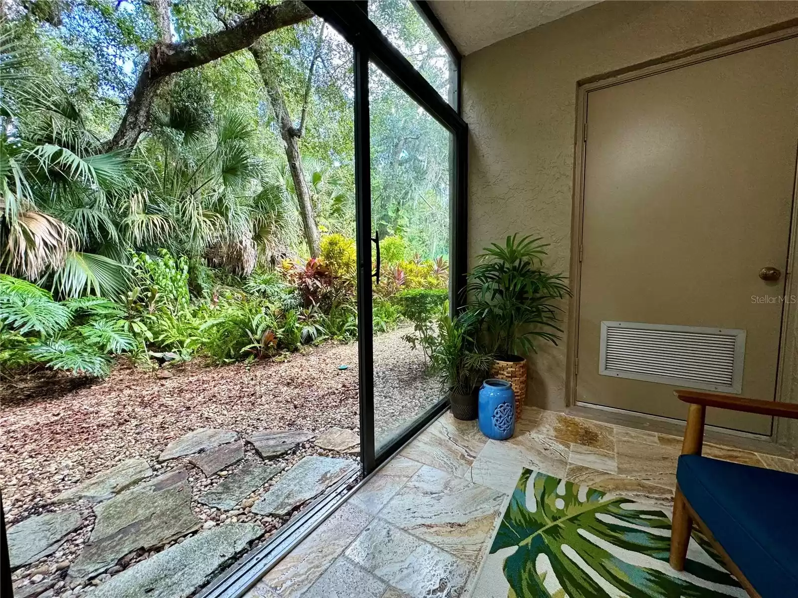 Back porch with sliding door access to the backyard