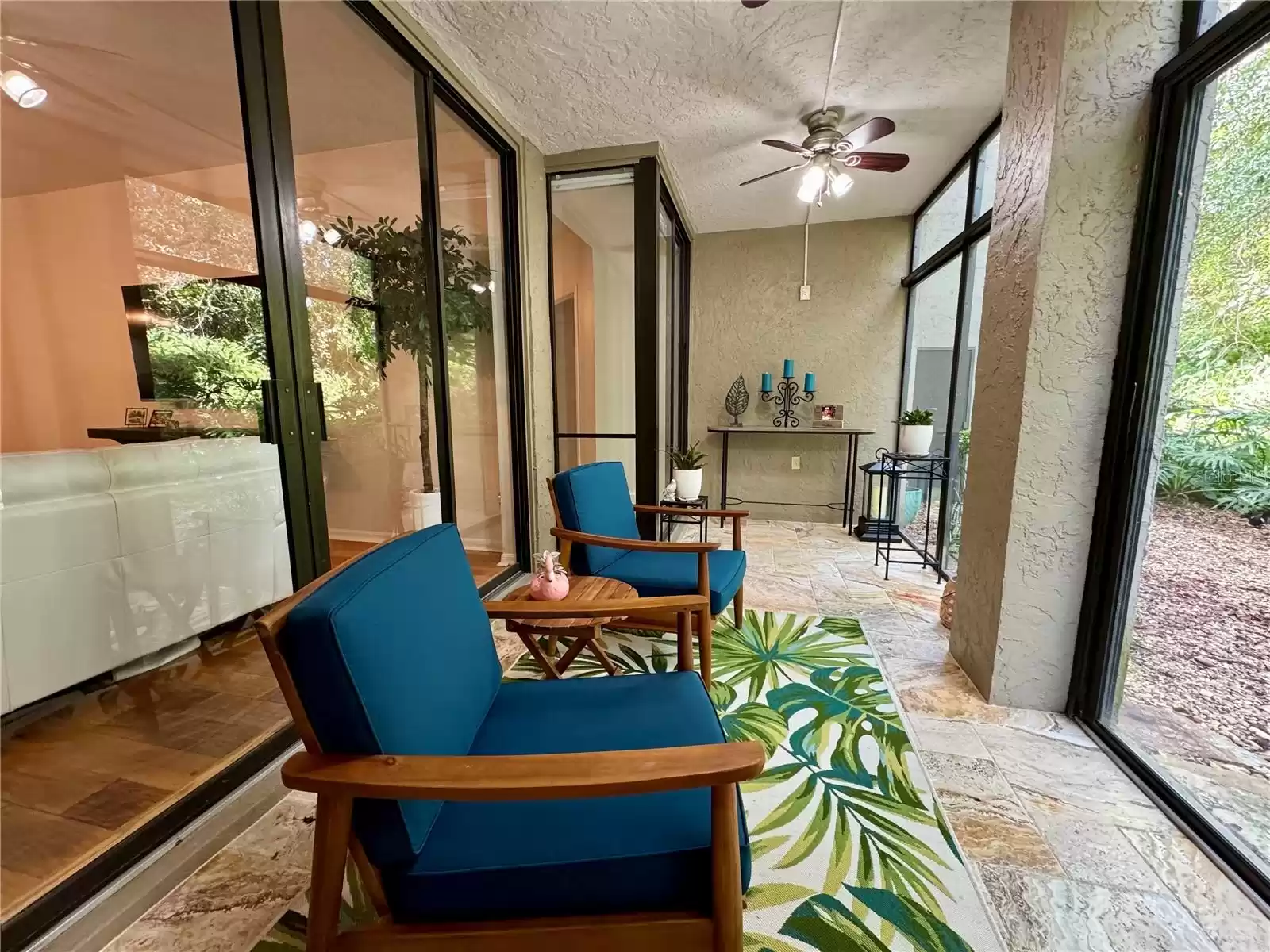 Back porch with double entrances to living room and first bedroom