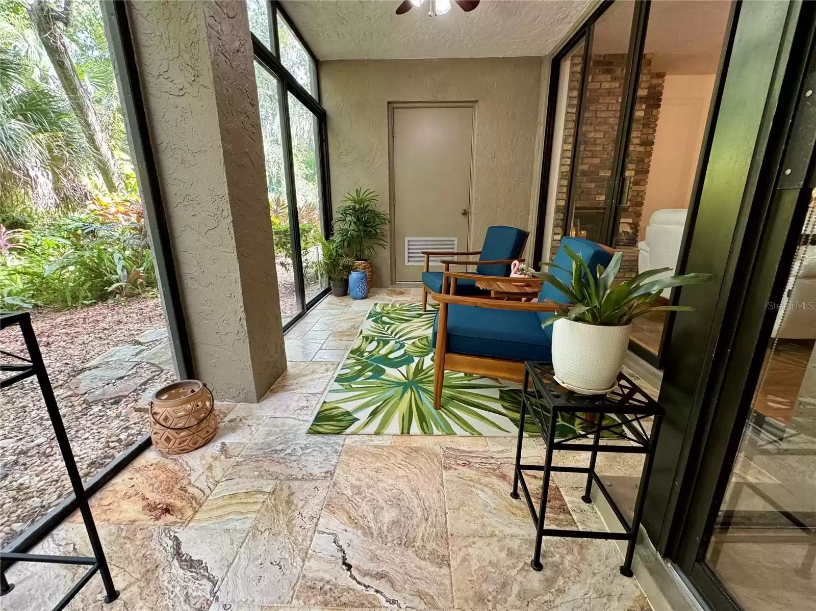 Back porch with sliding door access to the backyard