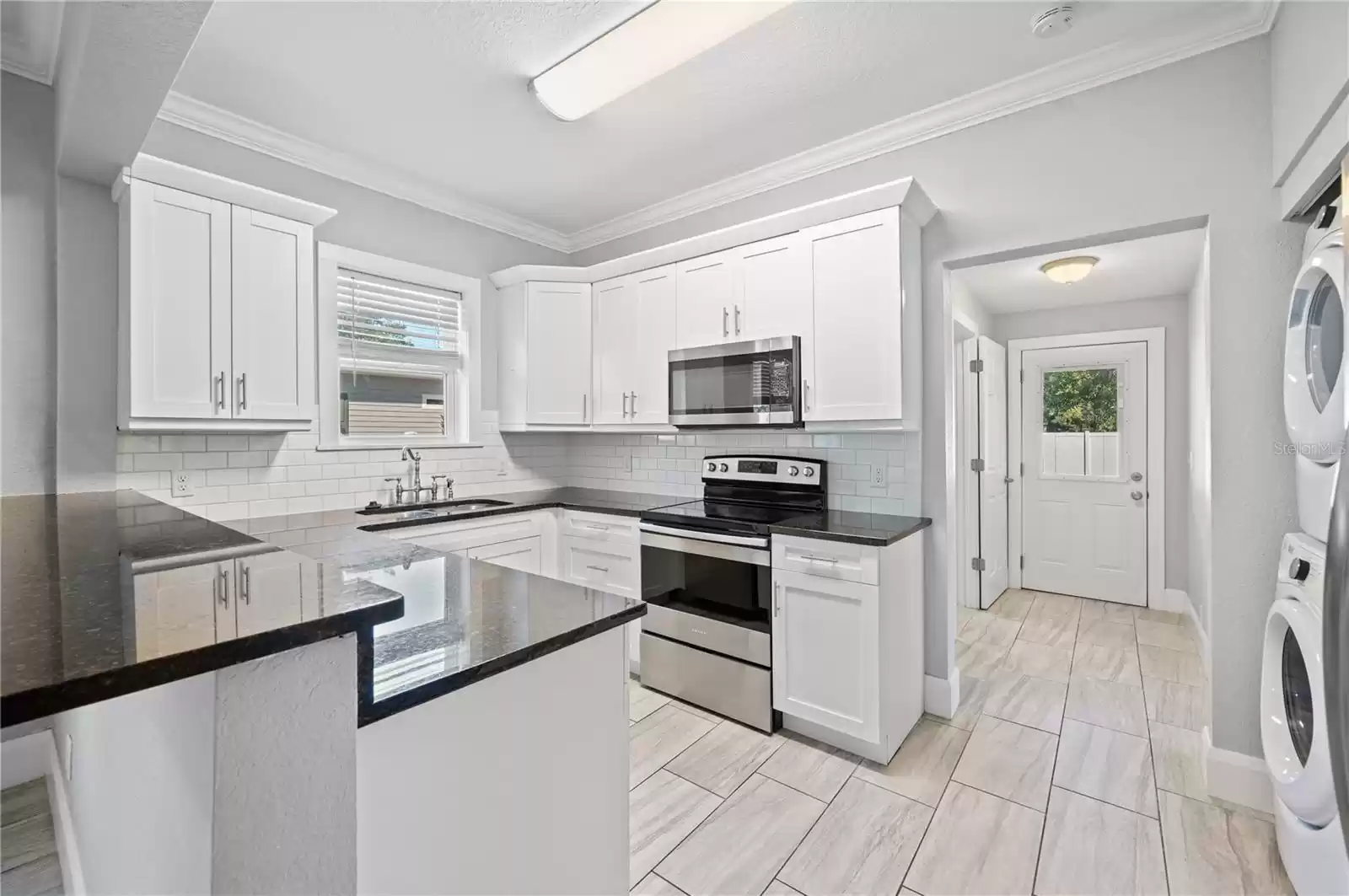 Kitchen with granite countertops and stainless steel appliances