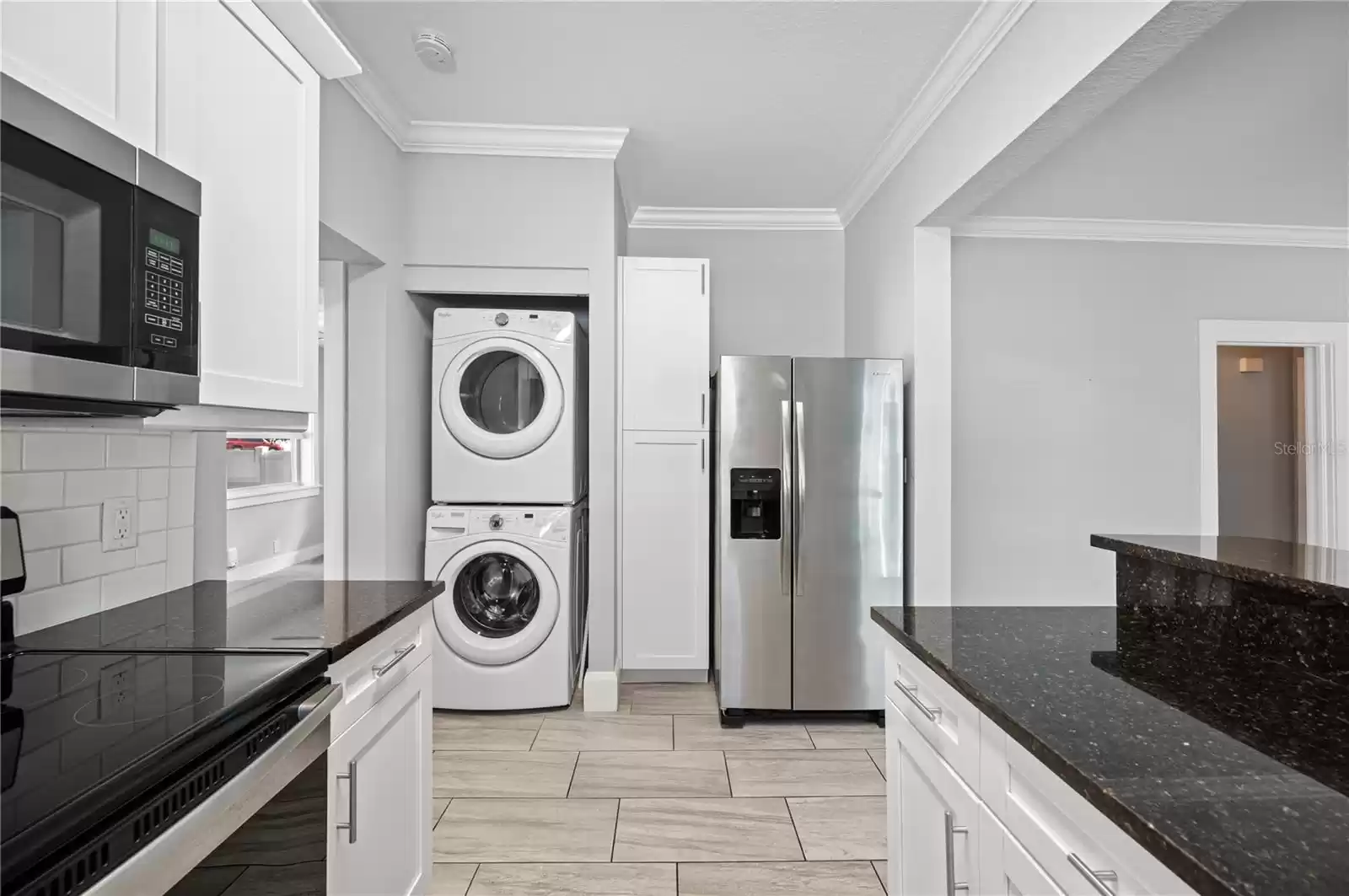 Stackable laundry conveniently in kitchen (comes with the home)