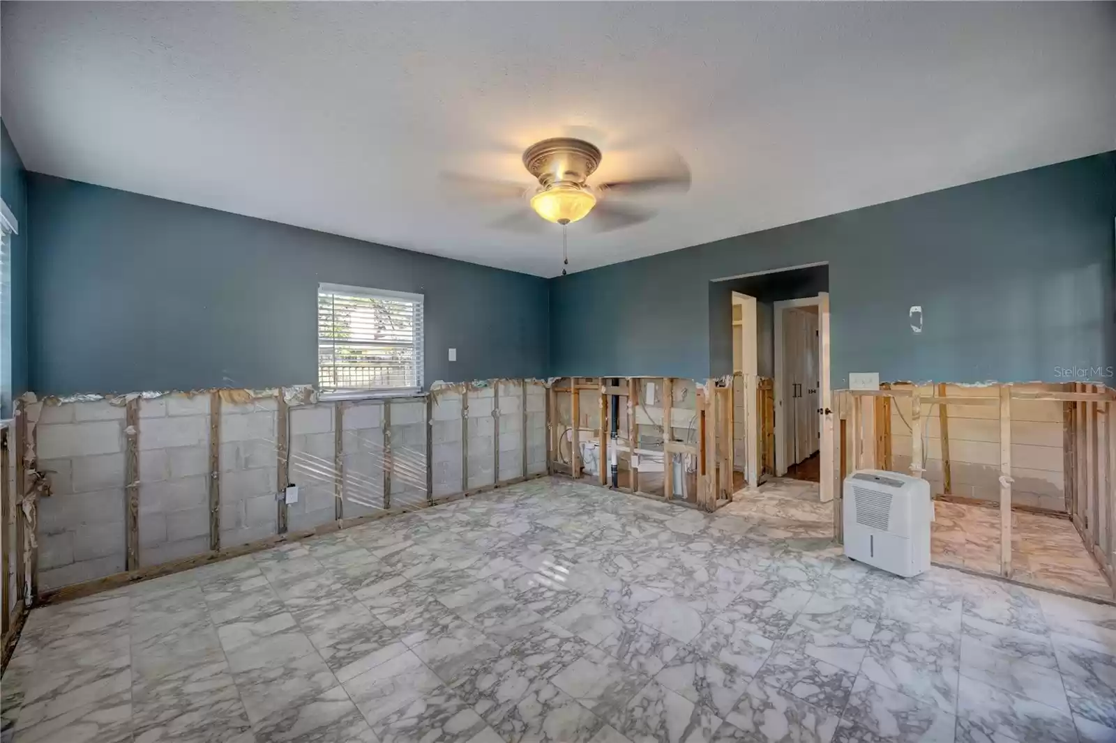 Primary Bedroom Suite w/ bathroom, walk-in closet, and french doors to the outside!