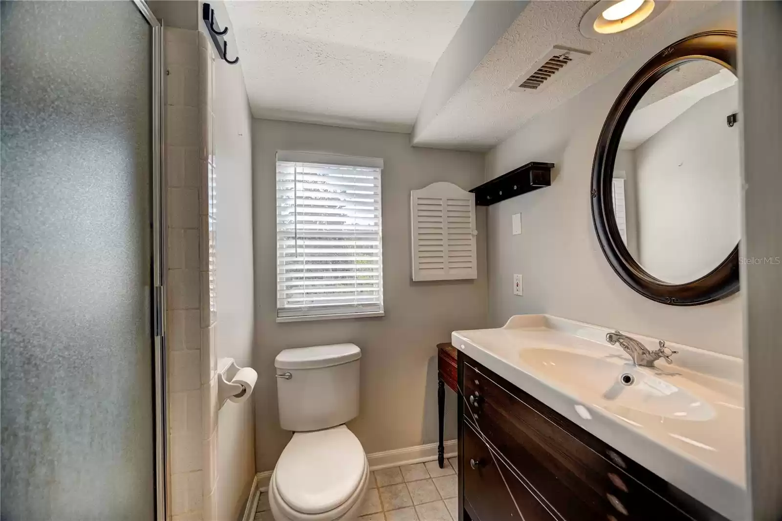 Private bath in bedroom 2 upstairs.