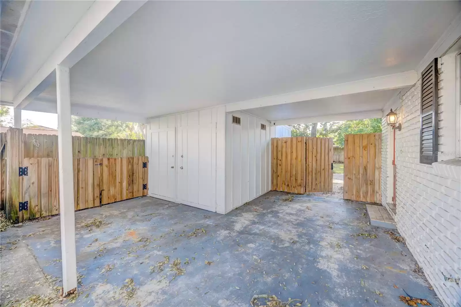 Carport with storage shed