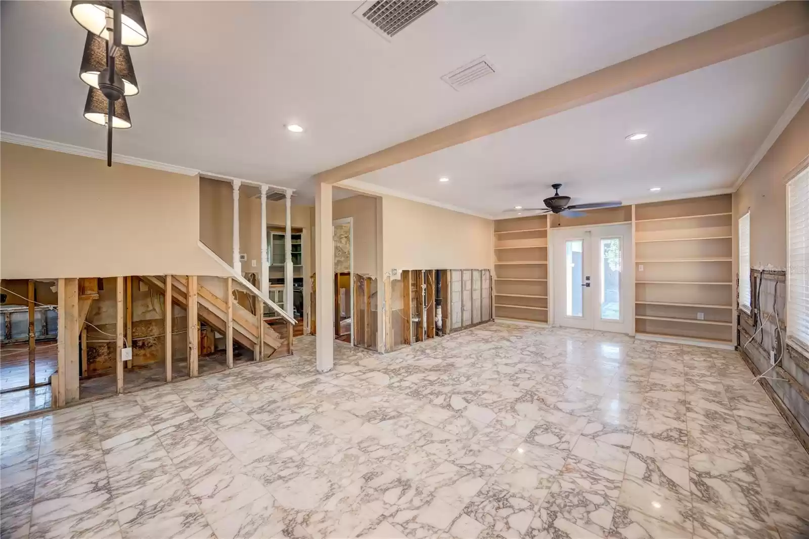 Open floor plan downstairs with the original Italian marble tile!