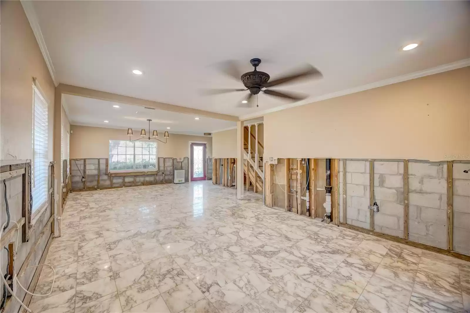 Open floor plan downstairs with the original Italian marble tile!