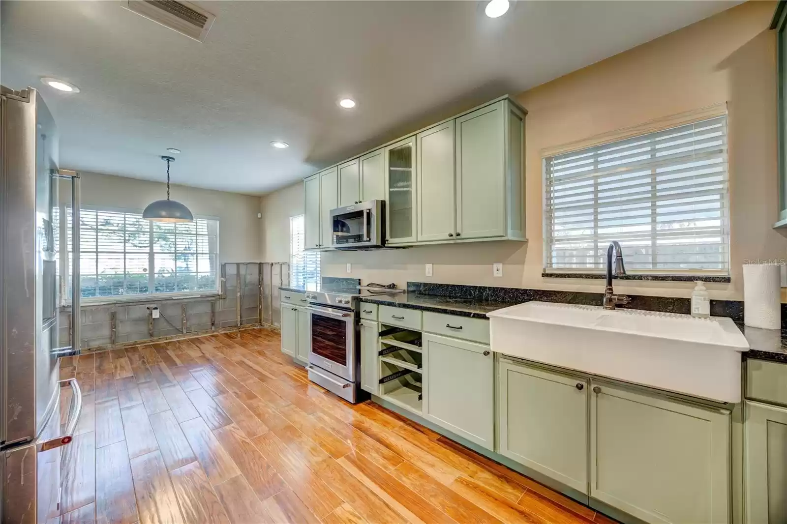 Kitchen with wood like tile floor and soap stone counters!