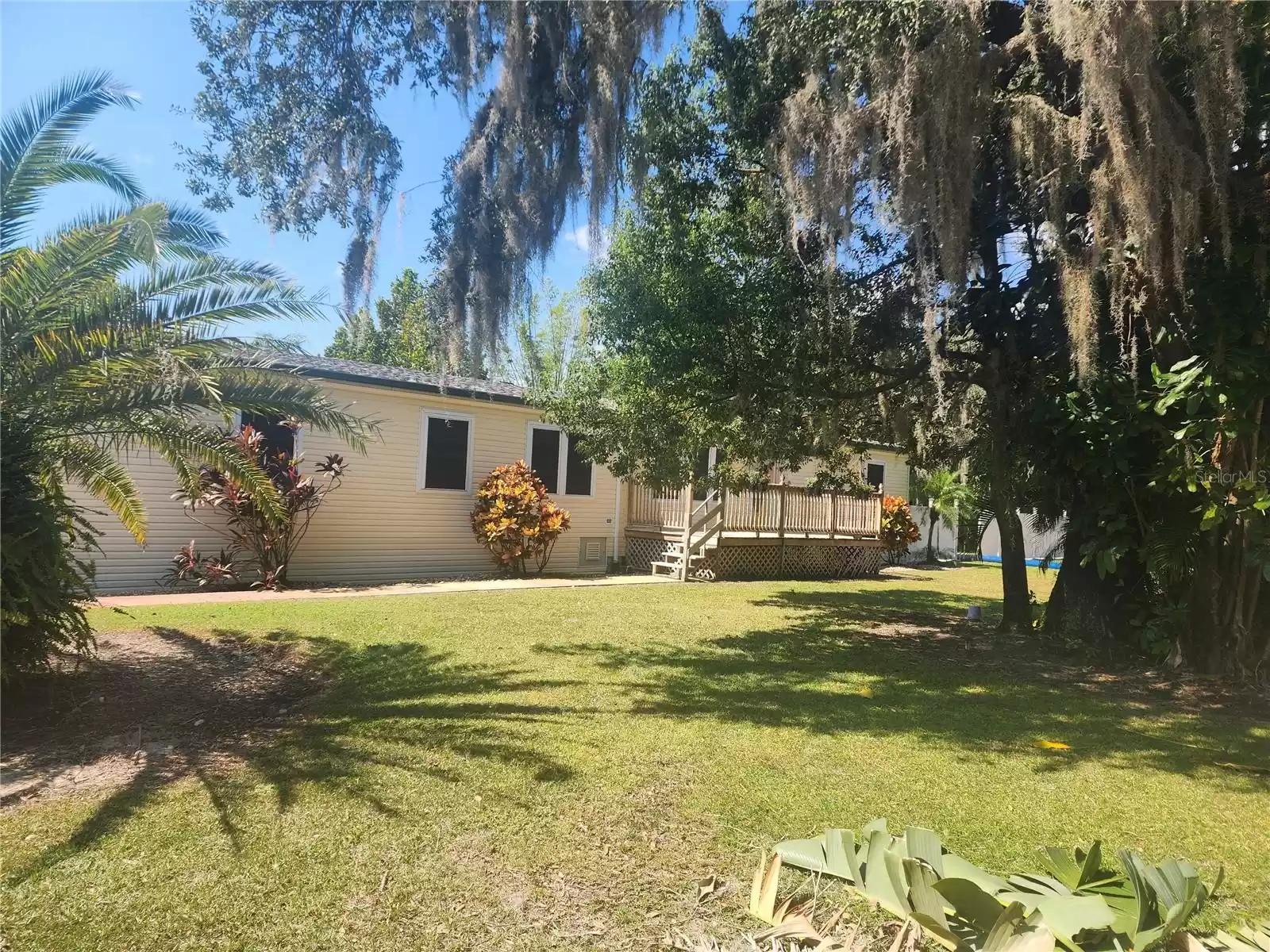 FRONT PORCH OVERLOOKING AN EXPANSIVE CORNER LOT