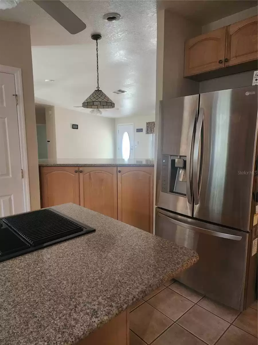 KITCHEN REFRIG OVERLOOKING BAR AREA