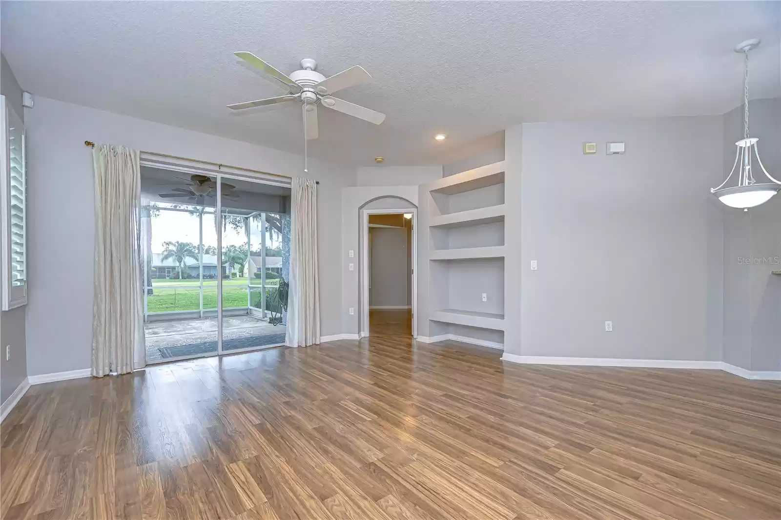 view from front entry; living room and patio