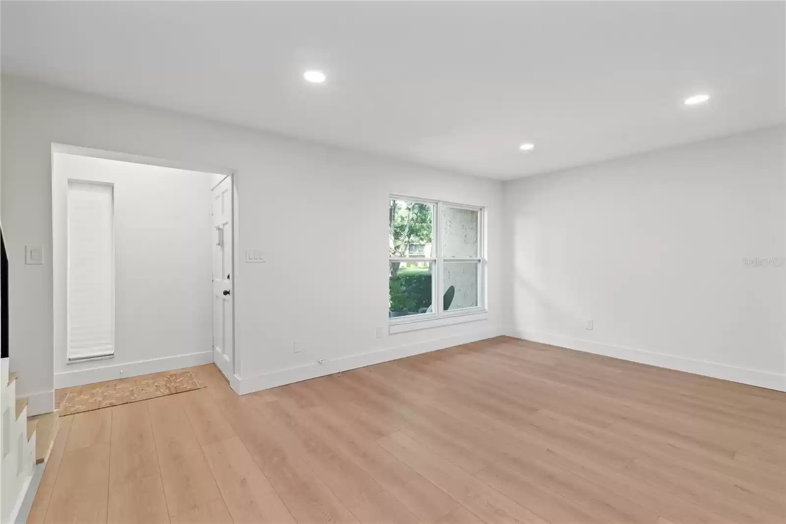 FAMILY ROOM AND FOYER - OVERLOOKING A PARK LIKE SETTING