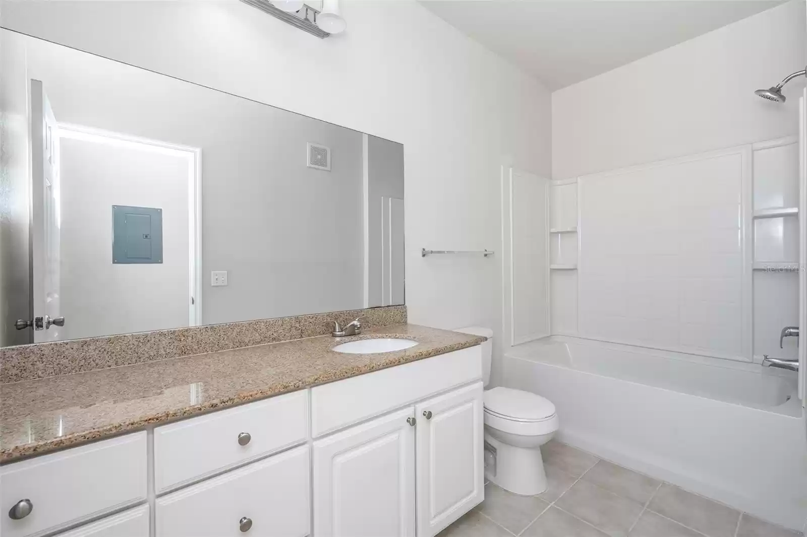 large bathroom with granite countertop