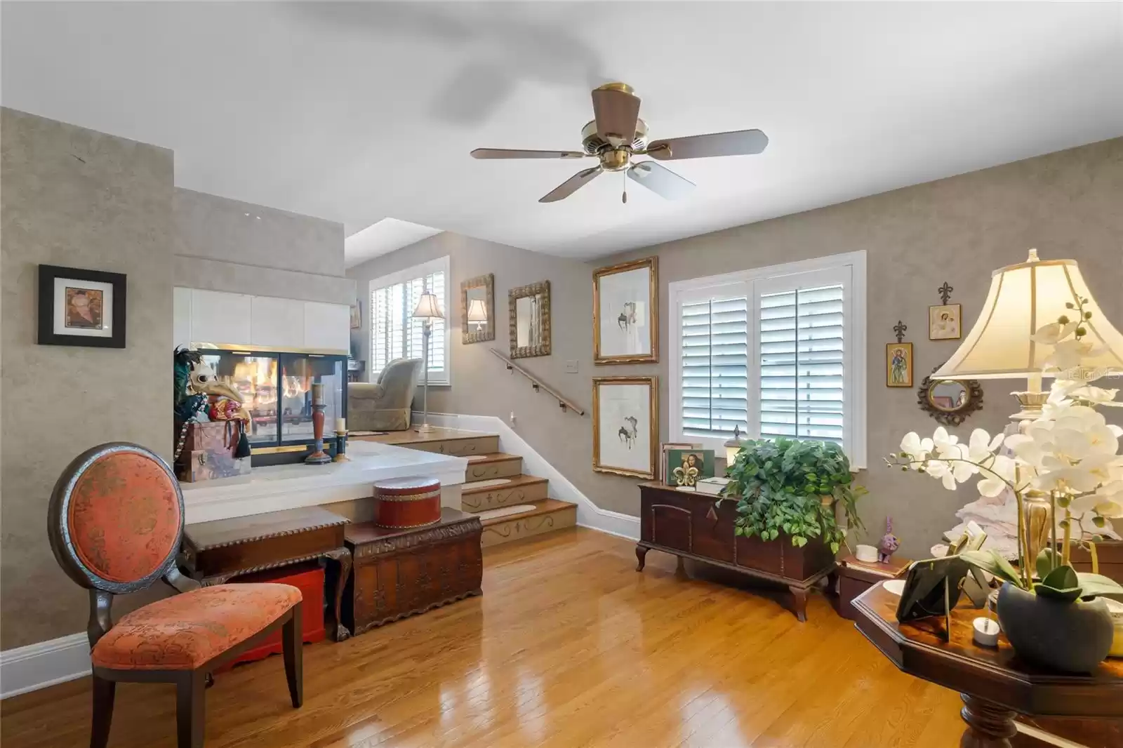 Spacious owner's suite sitting area with fireplace