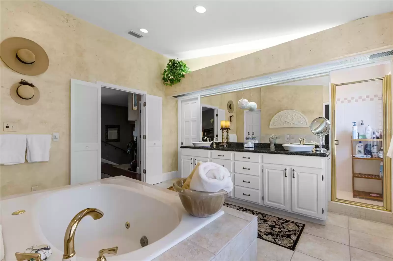 Dual sinks, stone countertops, separate shower and jetted tub are just a few highlights of the owner's bathroom