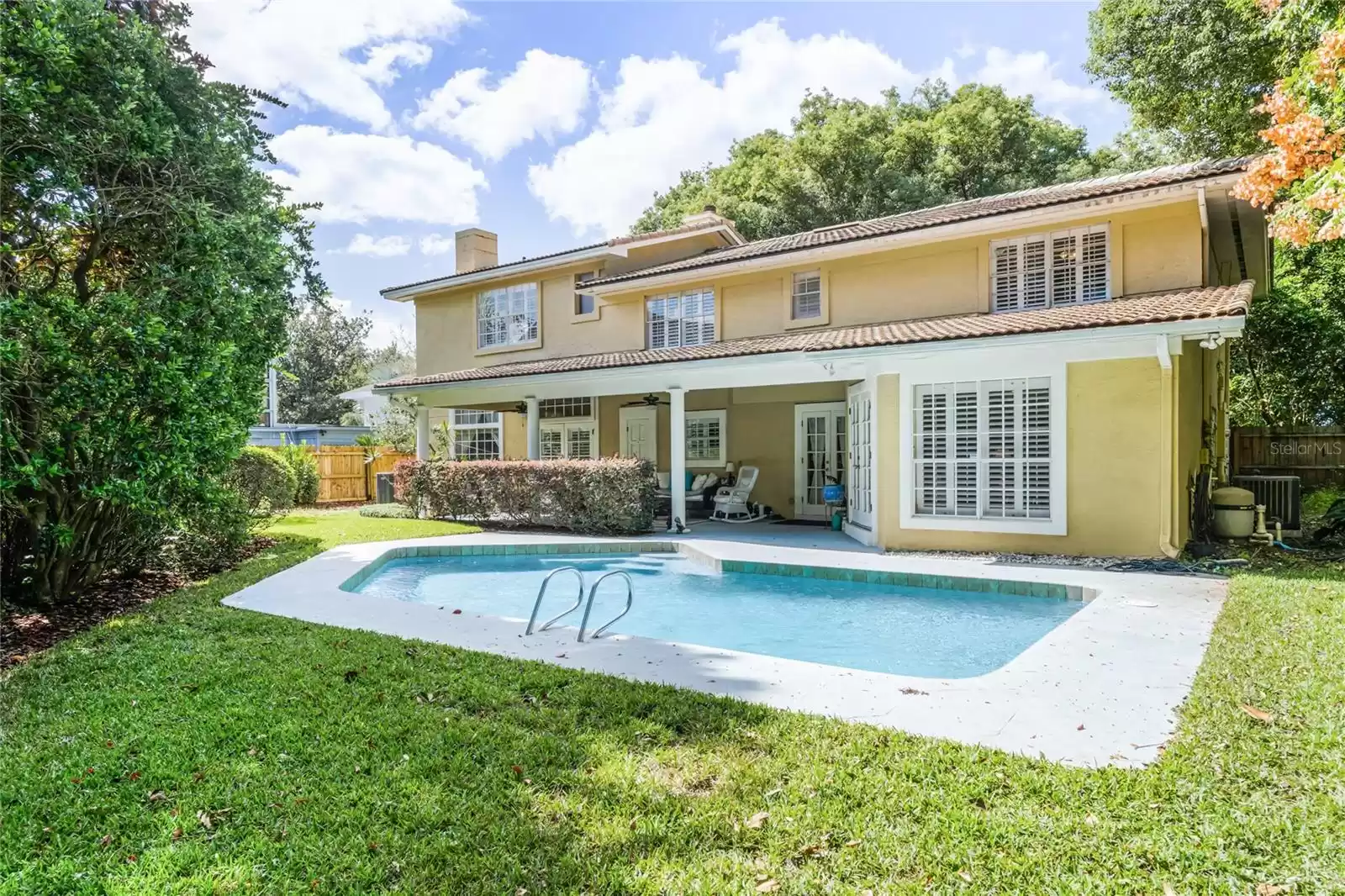 Expansive backyard highlighted by the private pool