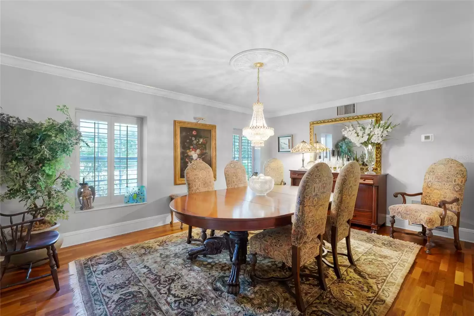 Formal dining room with chandelier centerpiece