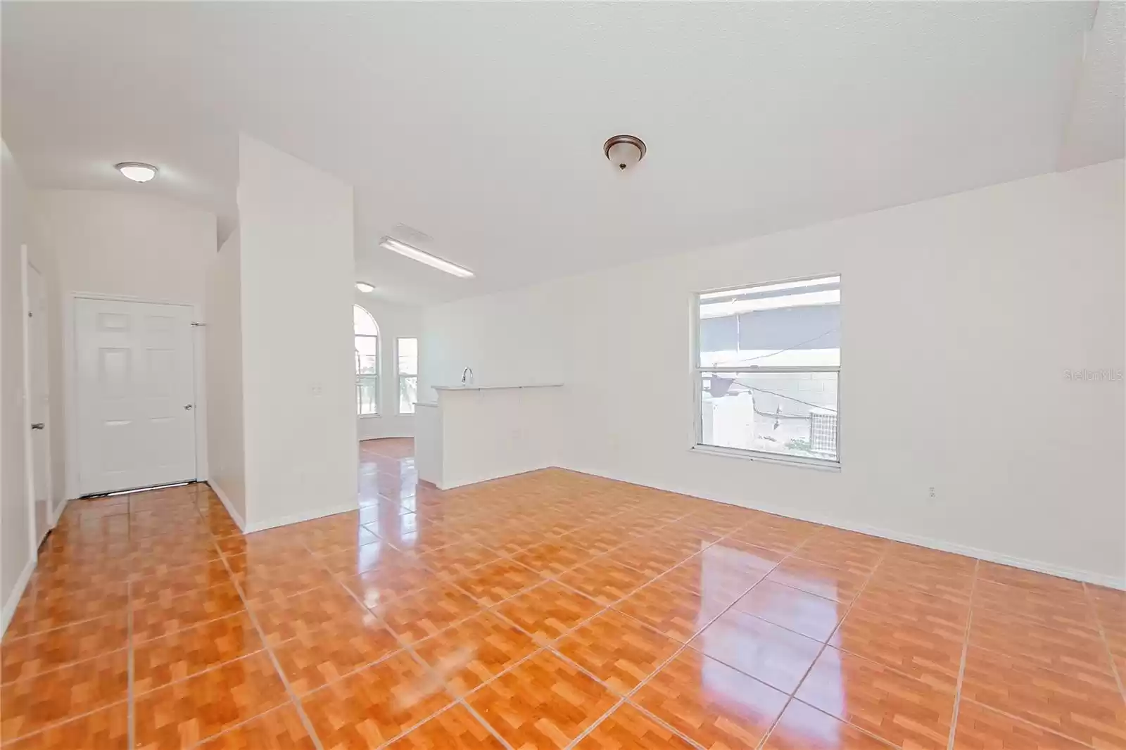 Living Room w/view of Kitchen + Entry