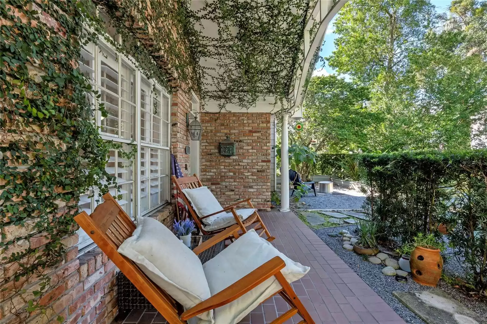 one of two outdoor front sitting areas