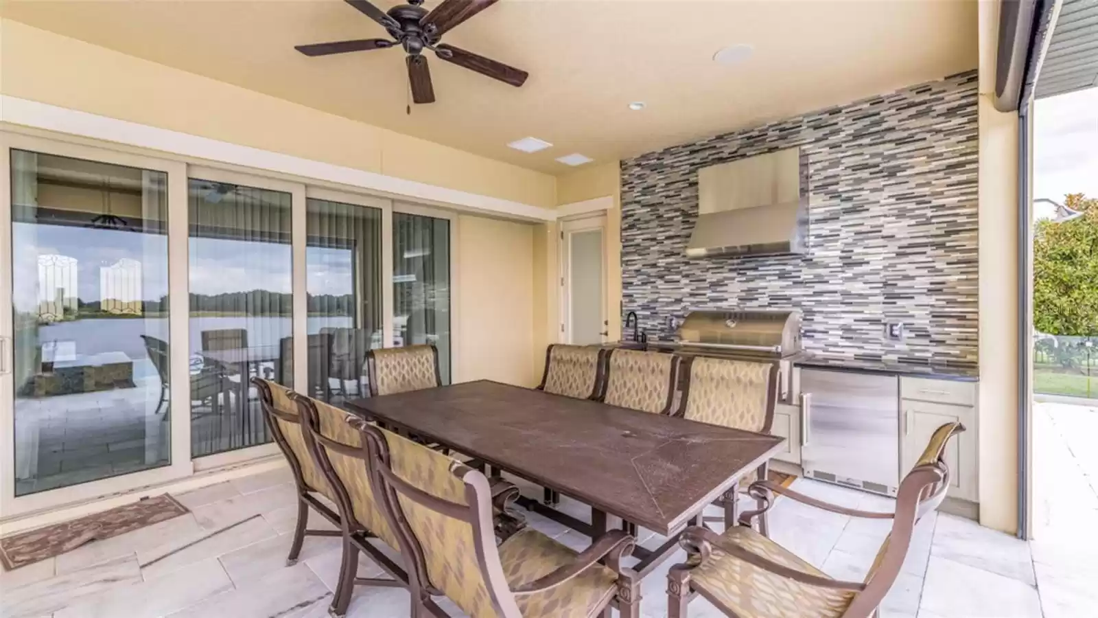 Outdoor dining area with fully equipped outdoor kitchen