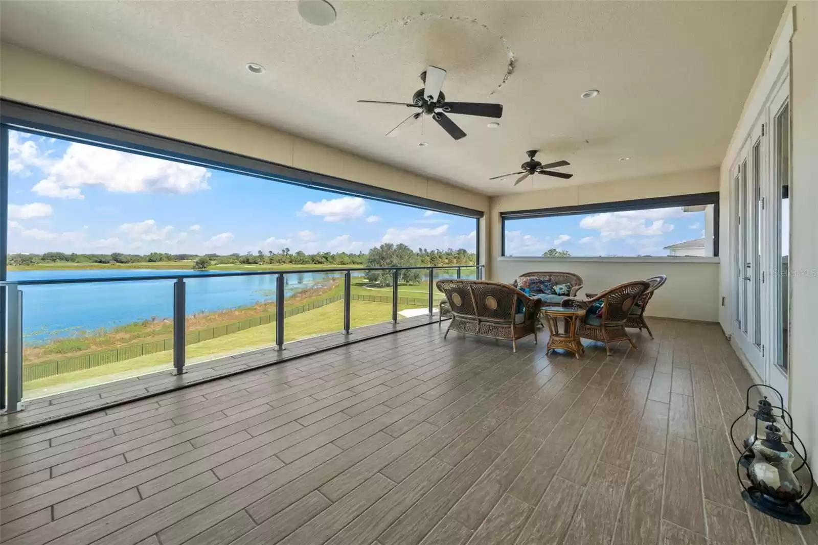 Extended balcony with level 5 weather resistant floor and glass railing