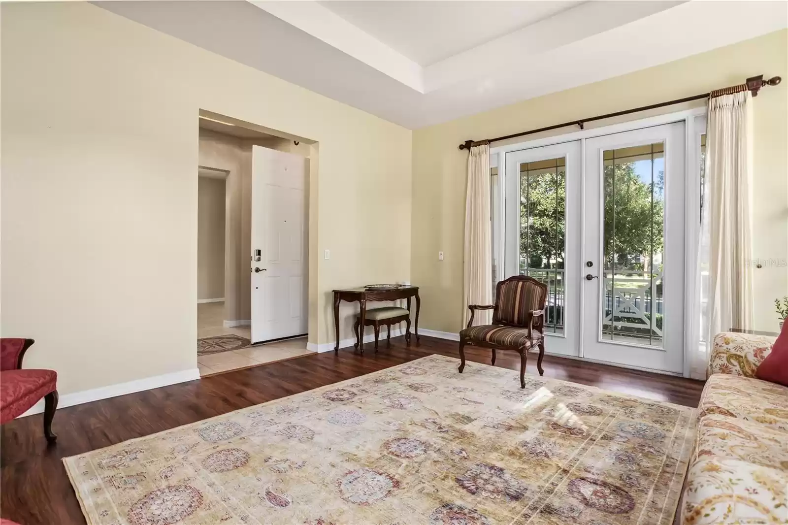 Formal Living Room with French doors opening to Front Porch