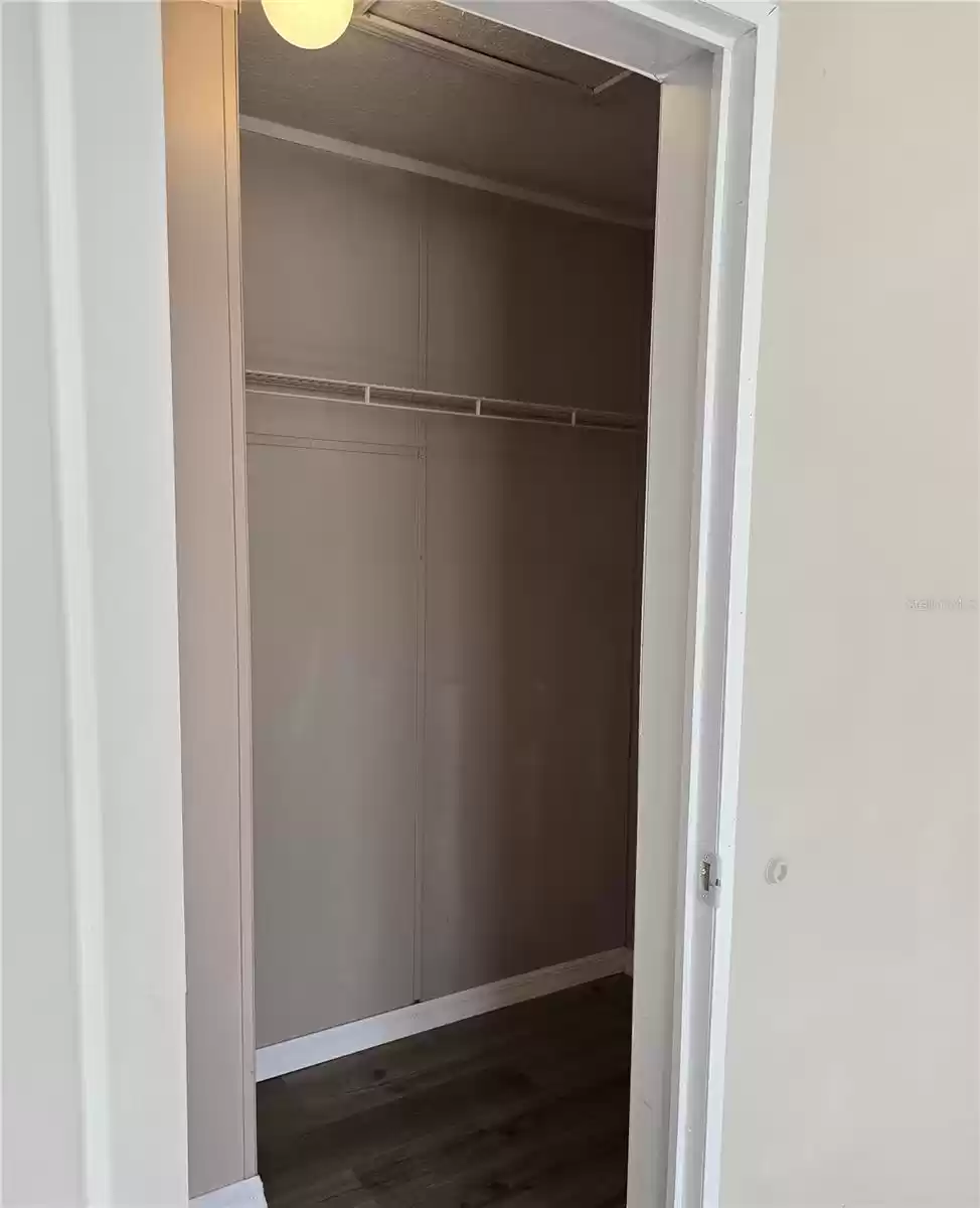 Primary Bedroom walk-in closet.