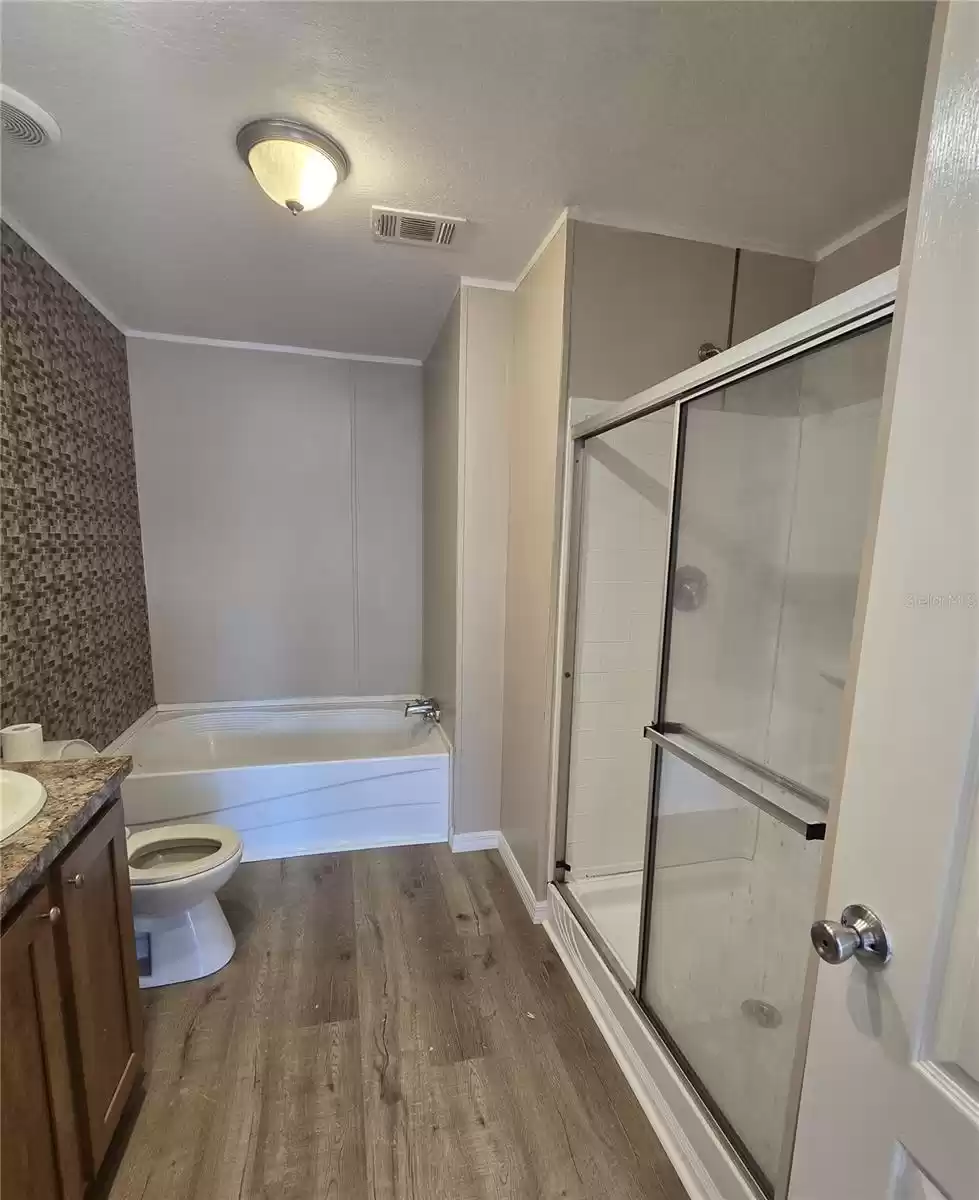 The en suite also offers a separate shower and soaking tub.