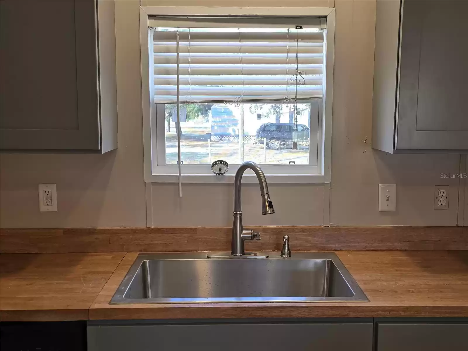 Includes large farmhouse sink and new faucet.