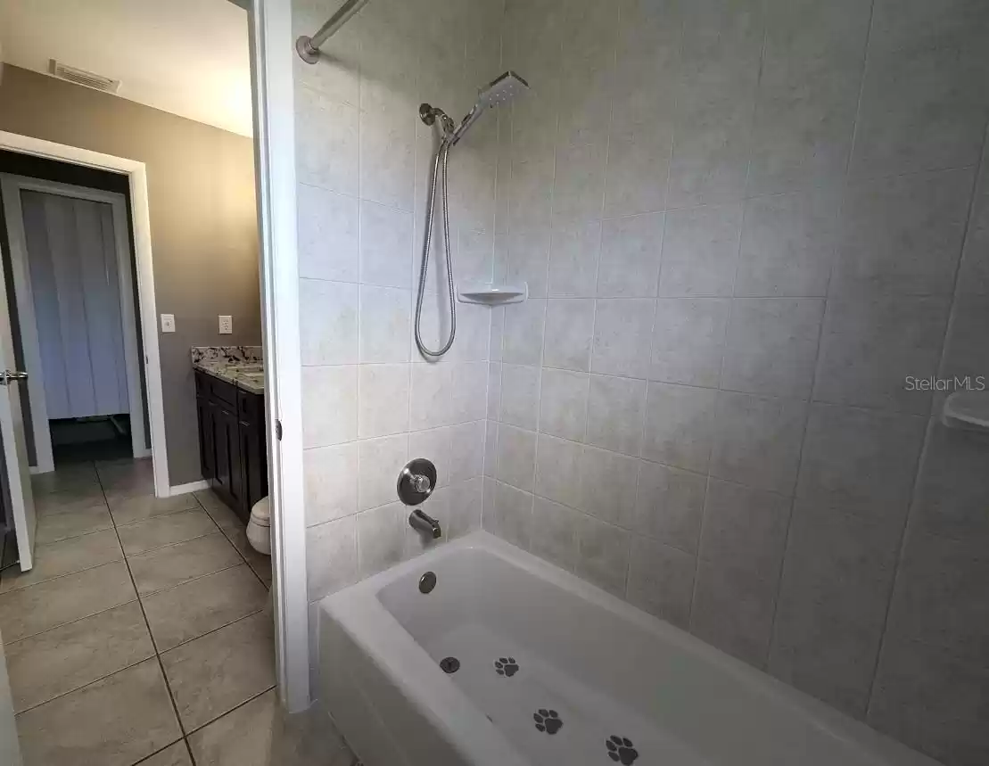 Tub shower and main bath with access from hallway