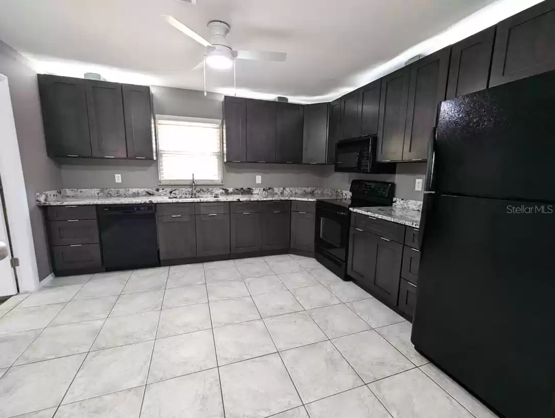 Fully updated, brand new kitchen with granite, custom lighting and new contemporary cabinetry