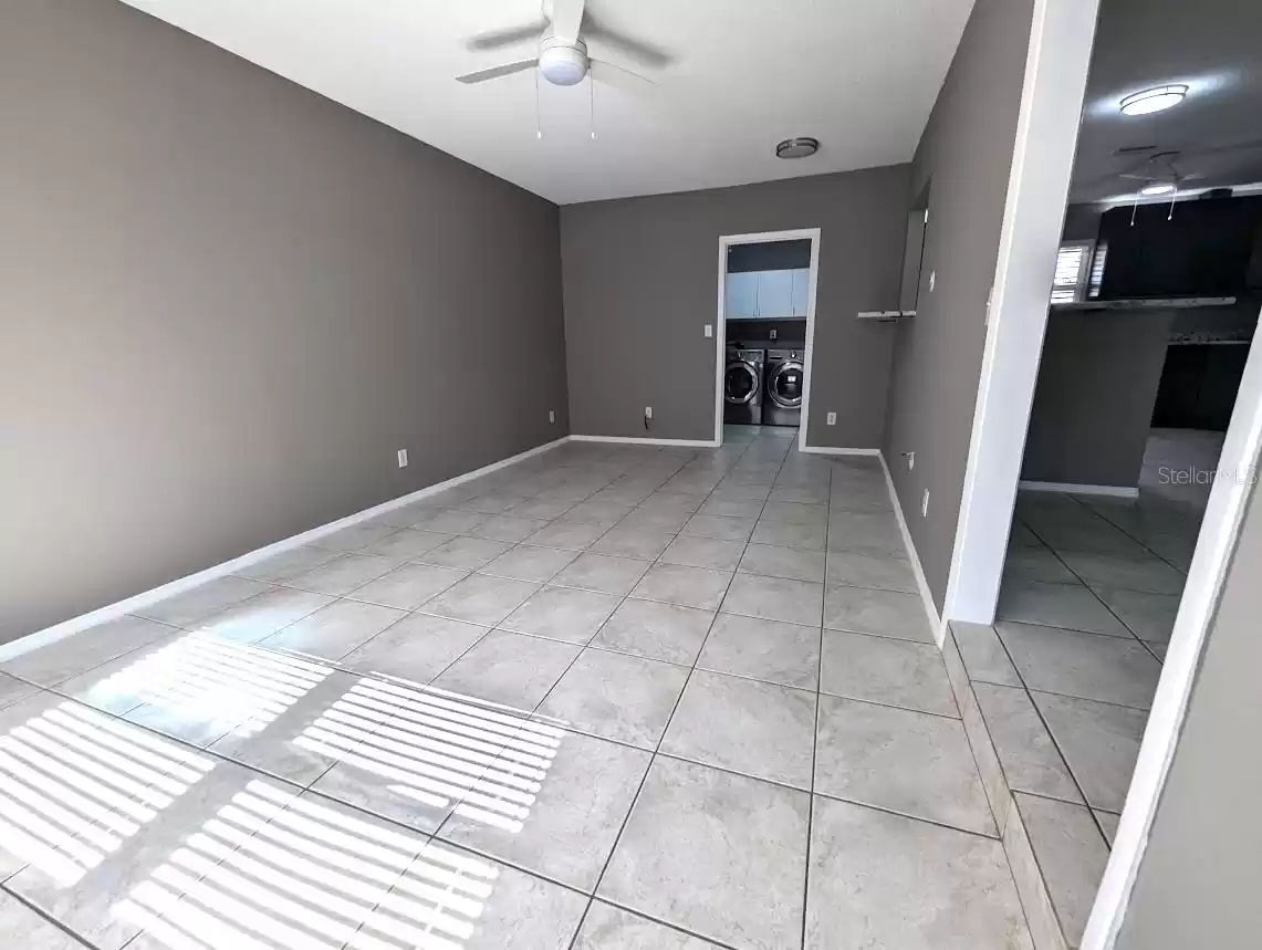 Family room with doorway to laundry room