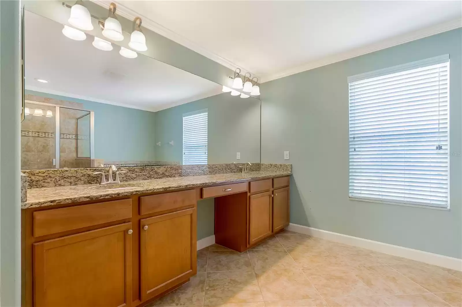 Primary bath double sink vanity with makeup area