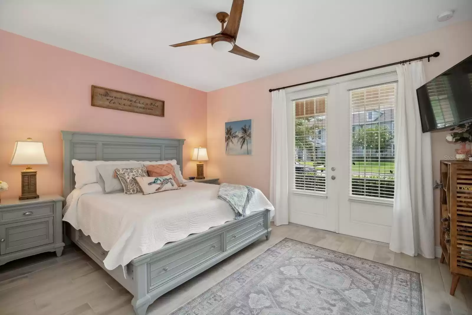 Primary en suite Bedroom with French Doors that lead to the private front porch