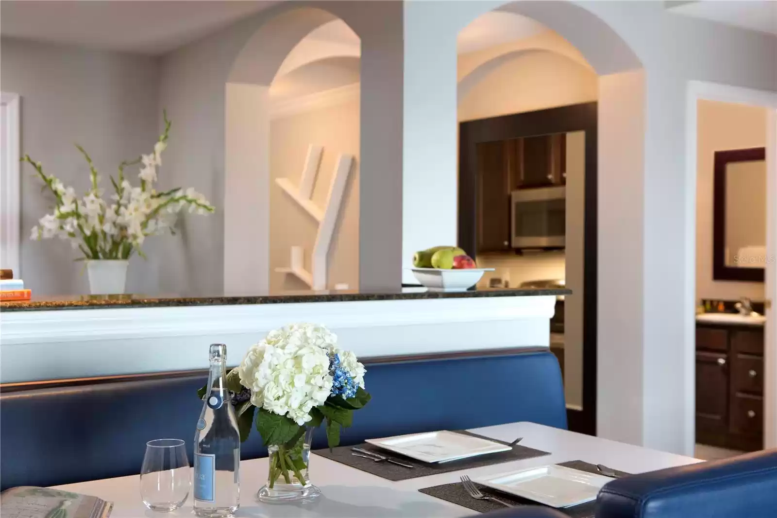 LOOKING BACK TOWARDS THE KITCHEN WITH DINING TABLE IN THE FOREFRONT