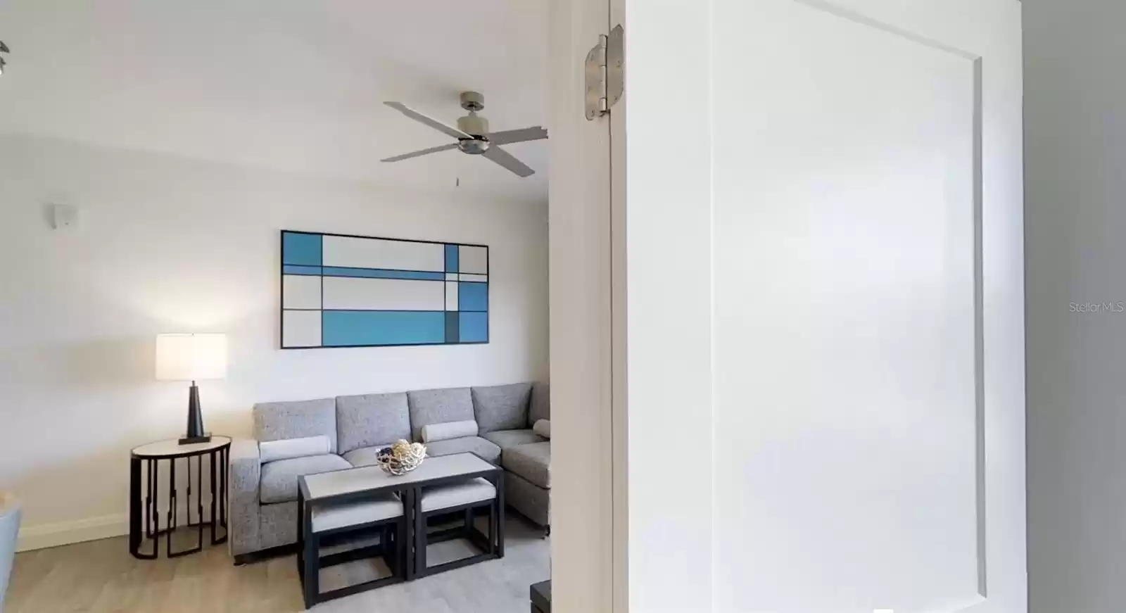 VIEW OF FOLD-OUT COUCH FROM THE PRIMARY BEDROOM