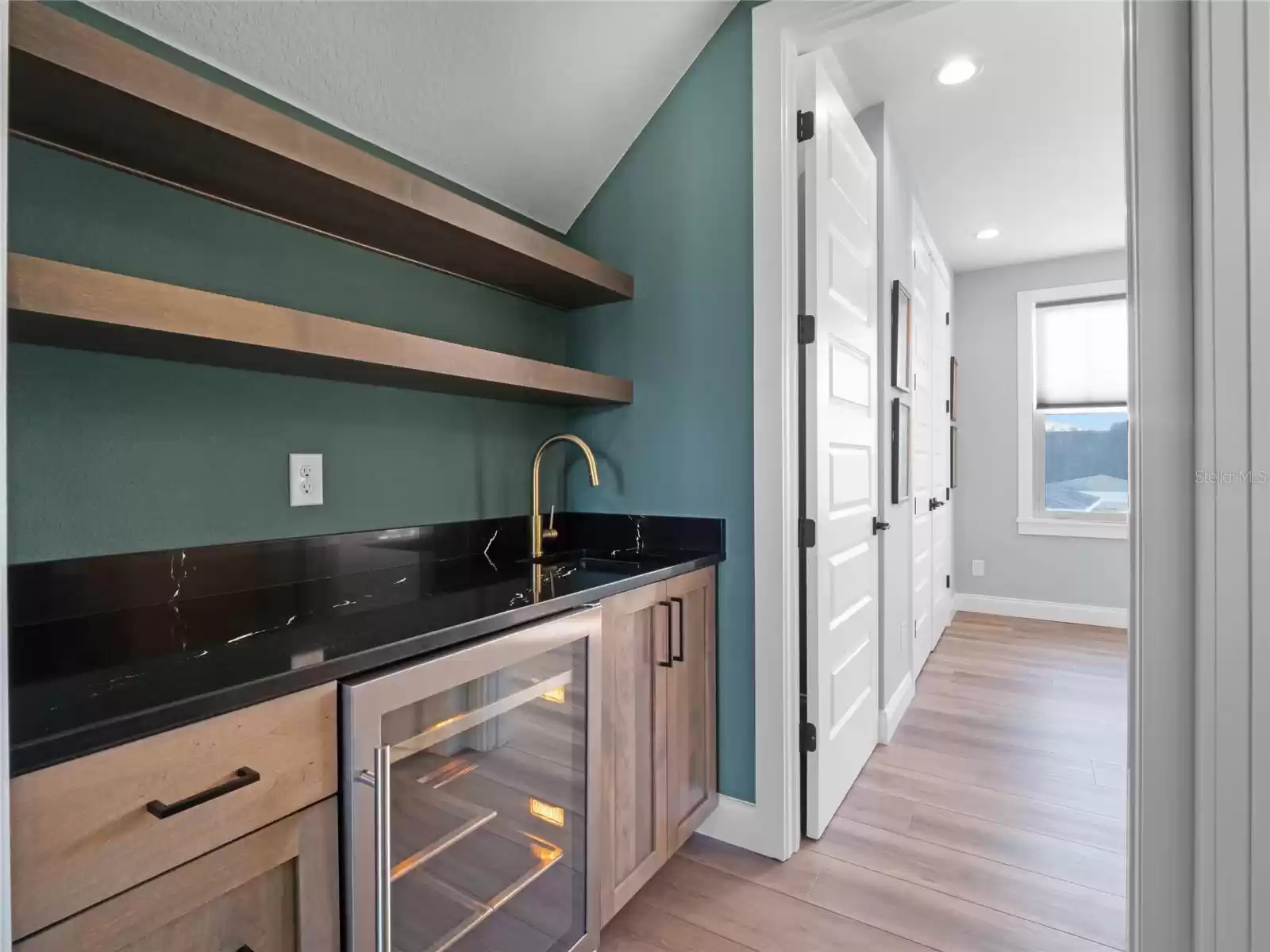 wet bar can easily be converted to kitchenette