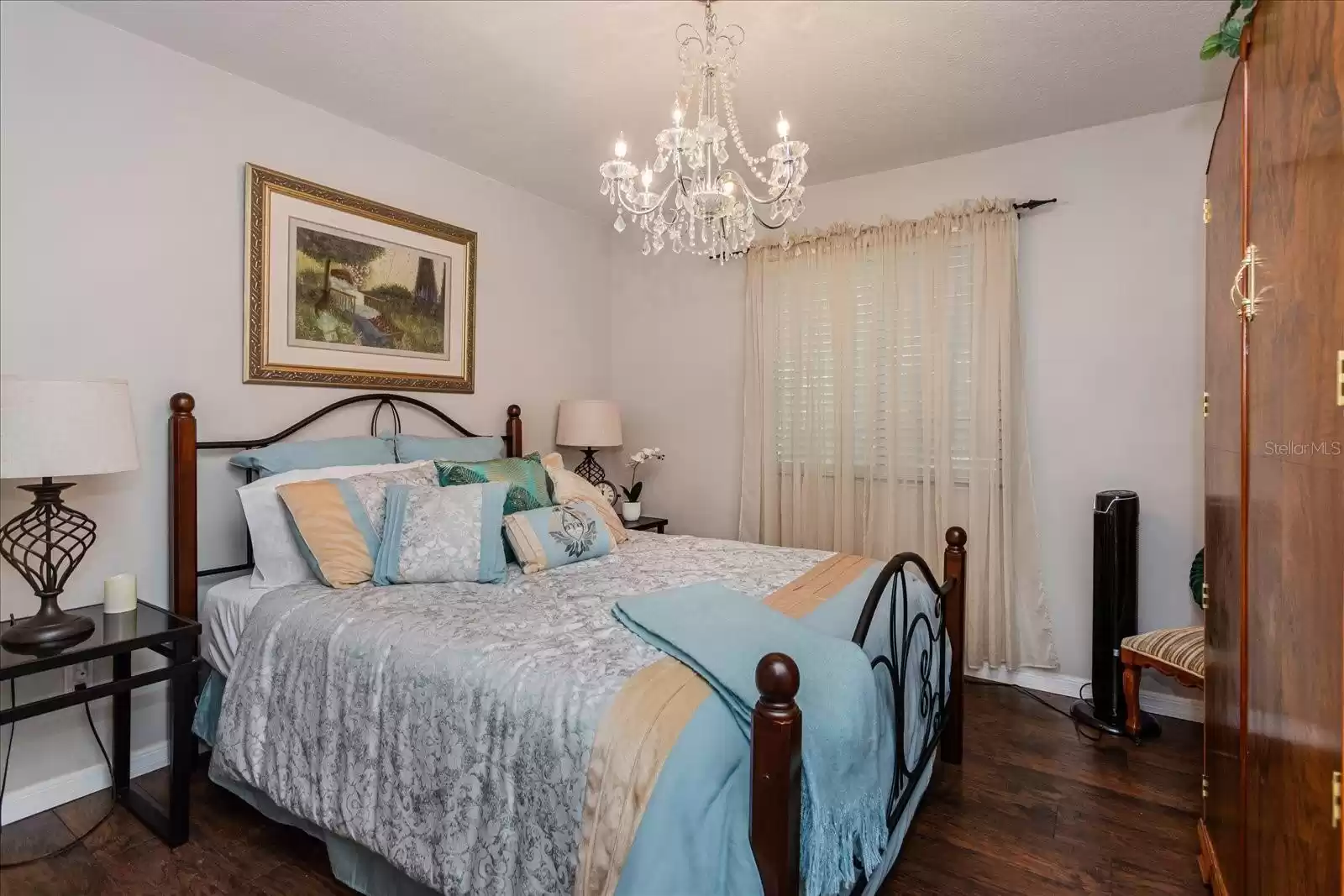 Second Guest bedroom features a beautiful chandelier.