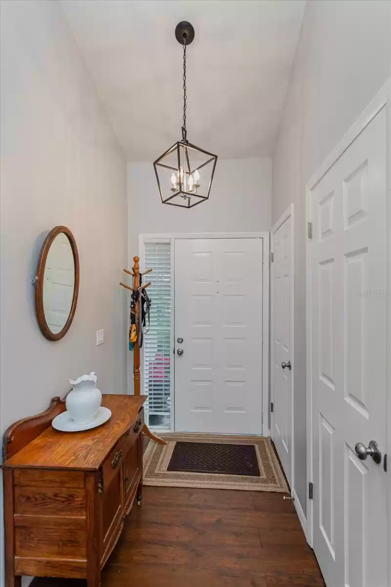 Foyer with Coat Closet & light fixture