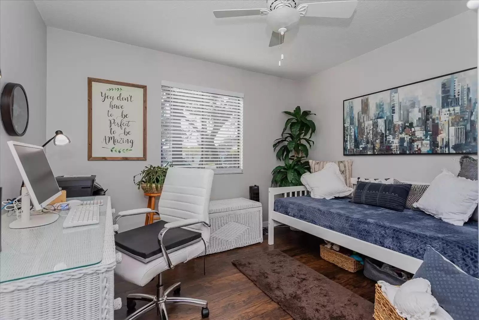 Third bedroom faces the front of the home and features a ceiling fan.