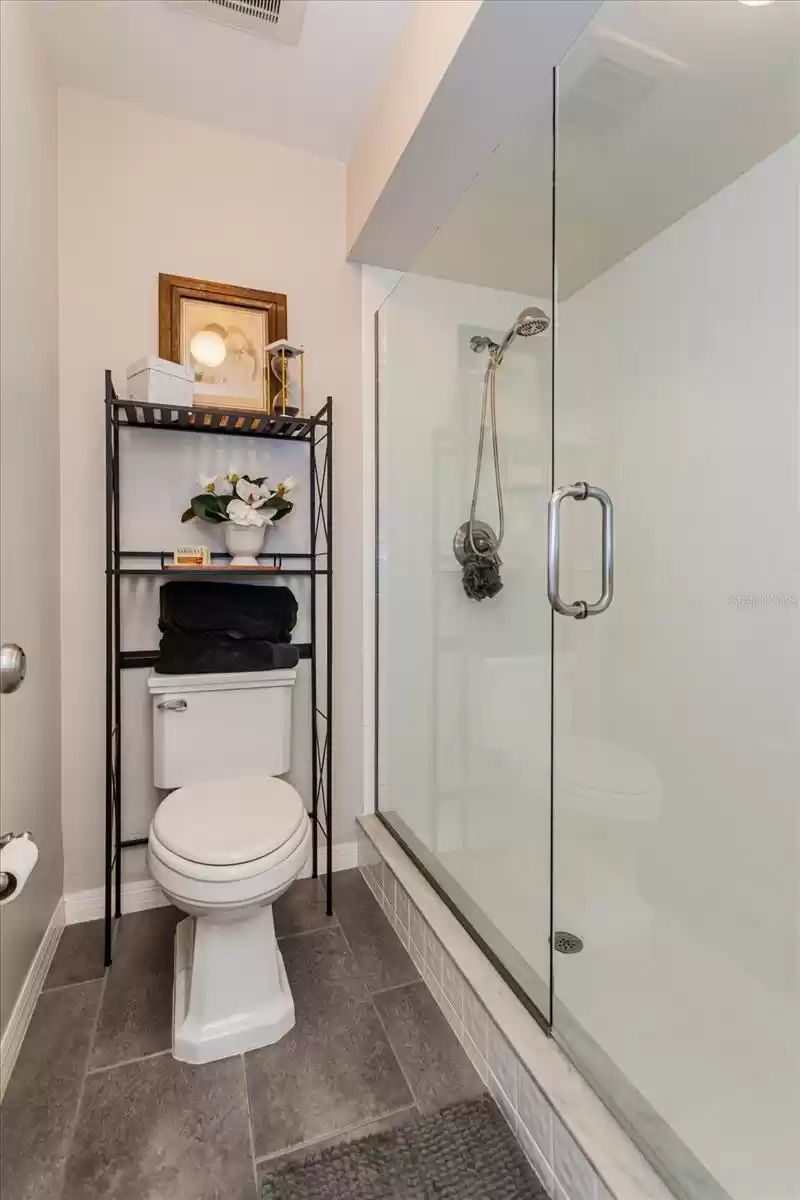 Newer expansive shower in primary bathroom.