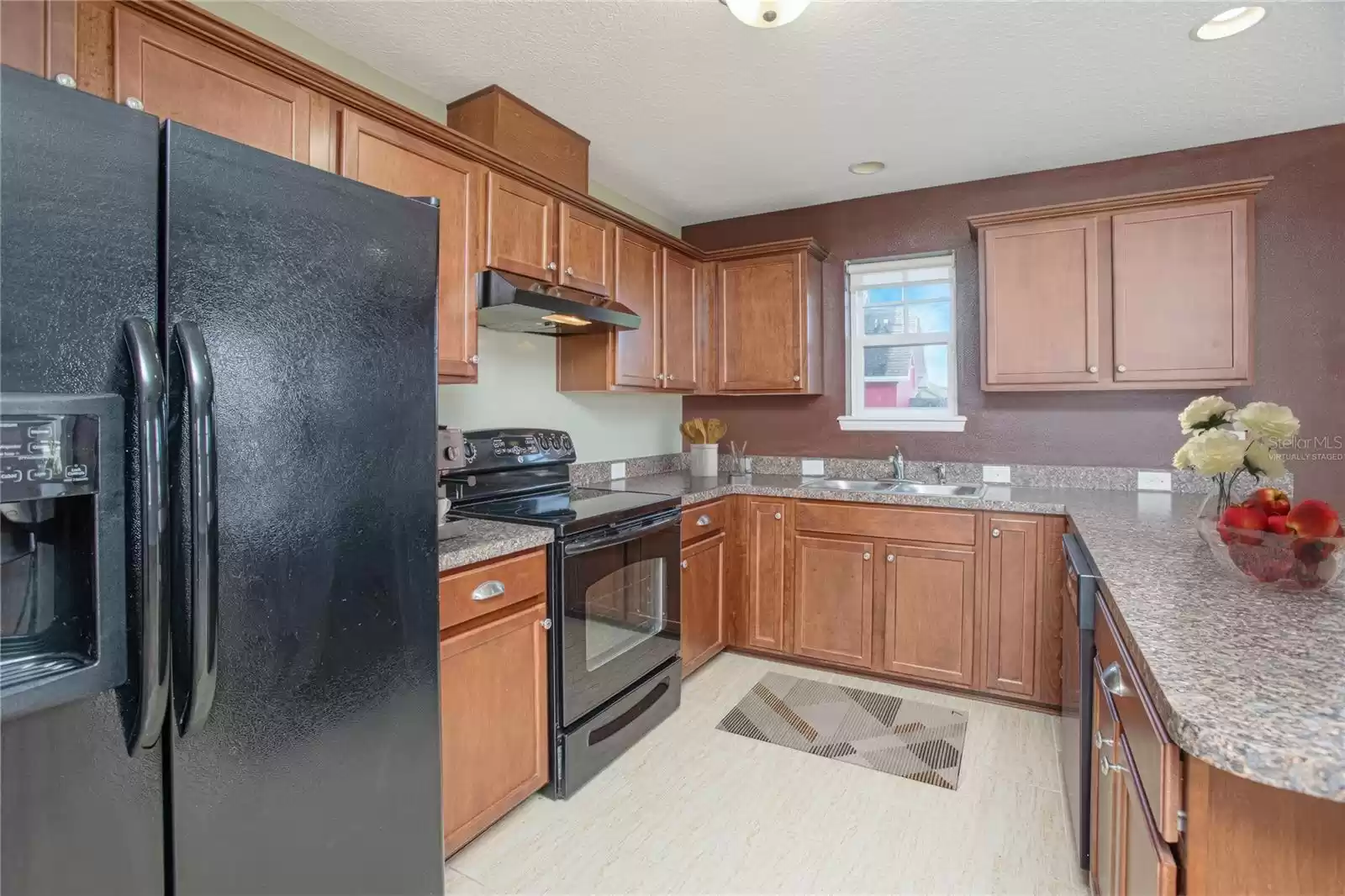 Virtually staged image. (Above Garage) Full Kitchen