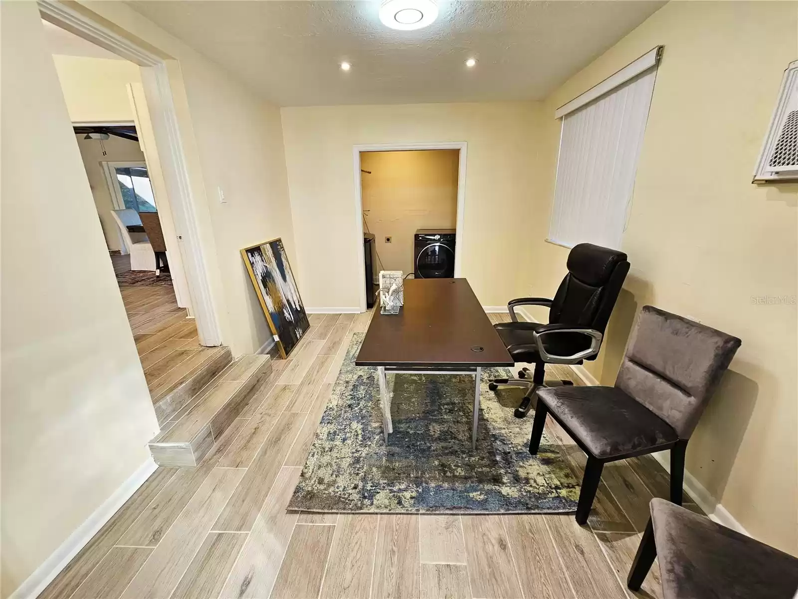 Primary Bedroom with view of closet/laundry room