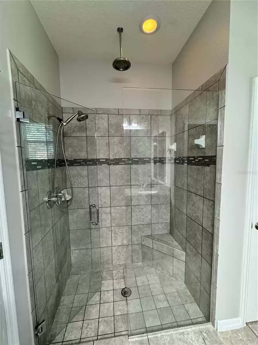 Master Bathroom framless shower with 2 shower heads