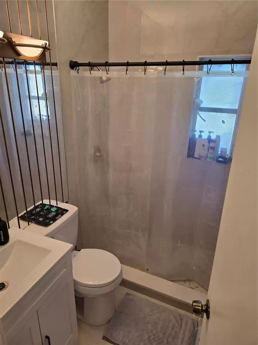 Main bathroom renovated with new tile shower,, commode and vanity.