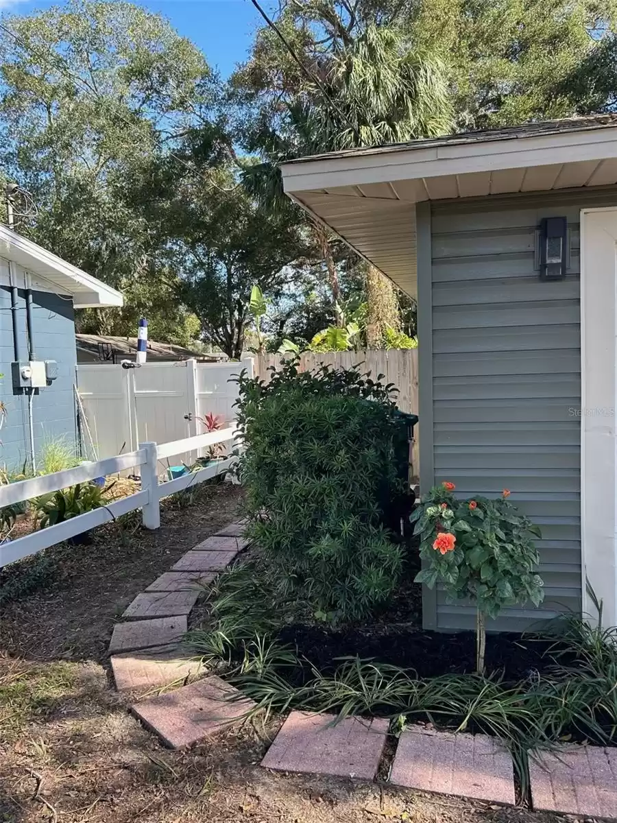 Left Side to side walk through door to garage