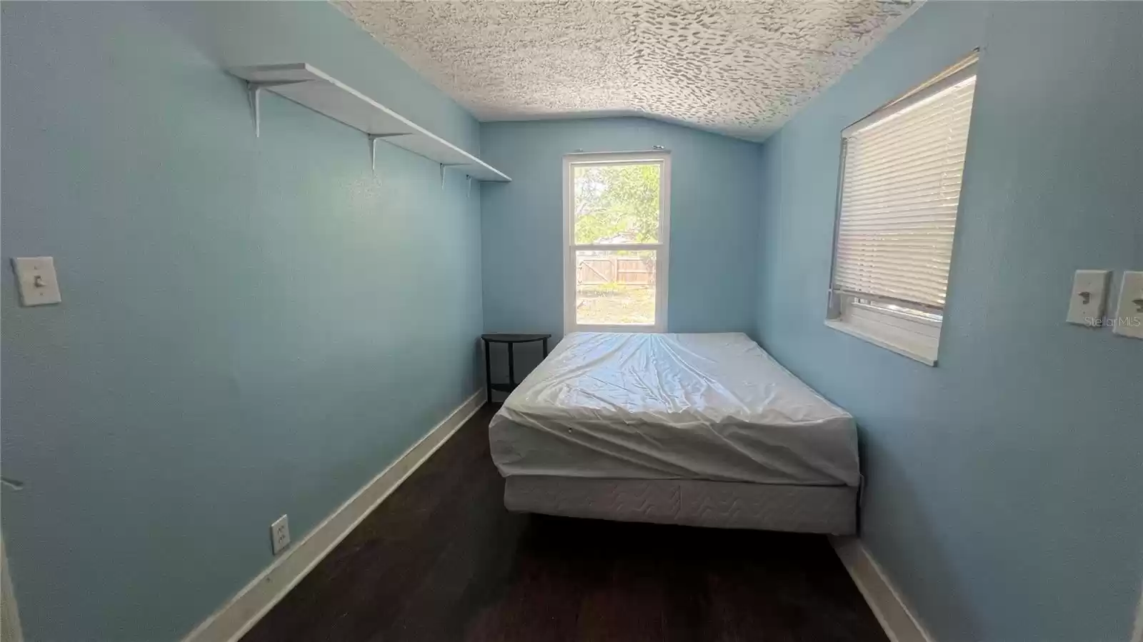 bedroom 2 w/ door to backyard