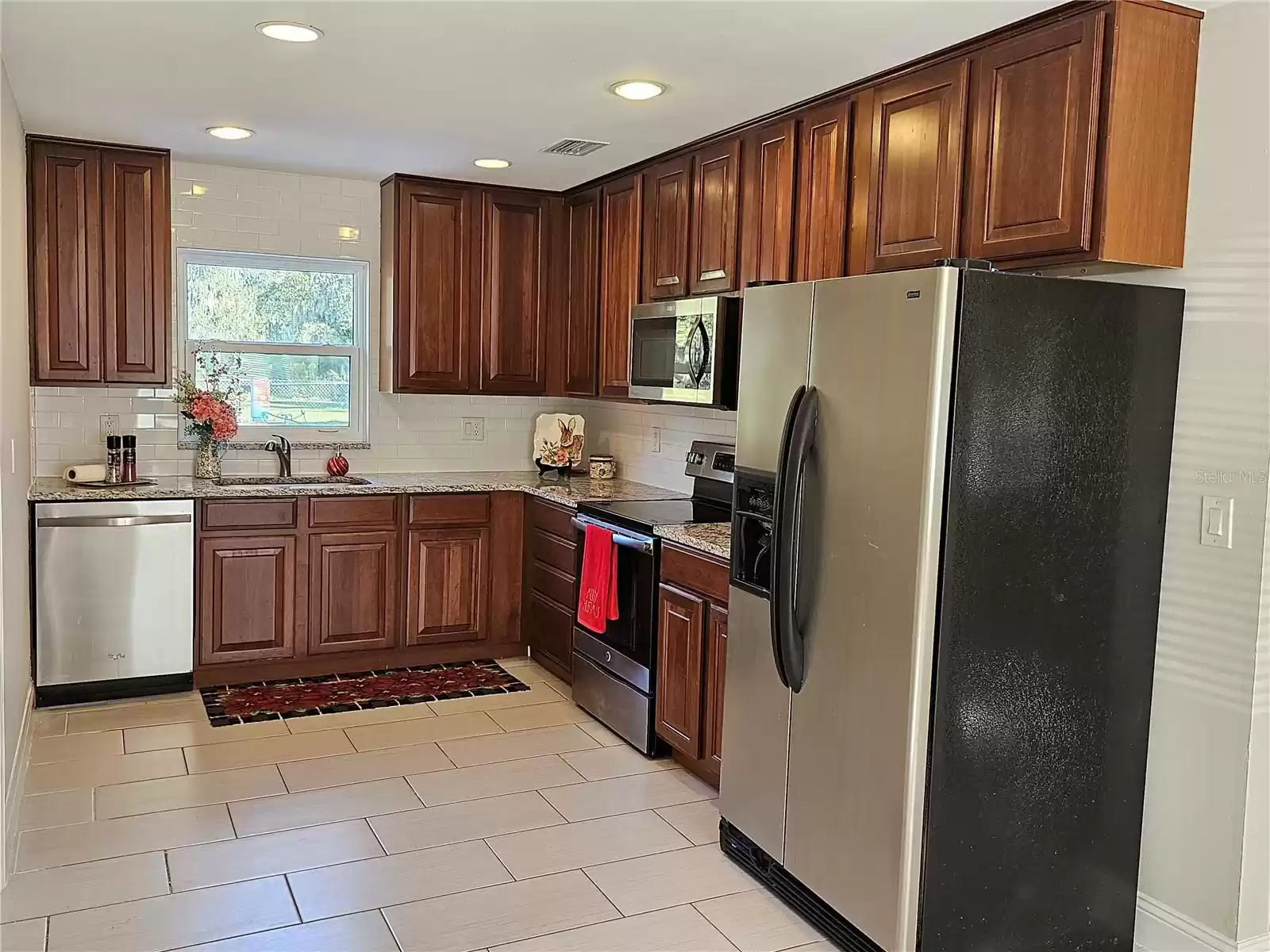 The window in the kitchen brings the Florida life style in.