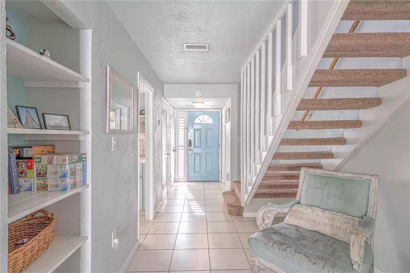 hallway with suspended stairway